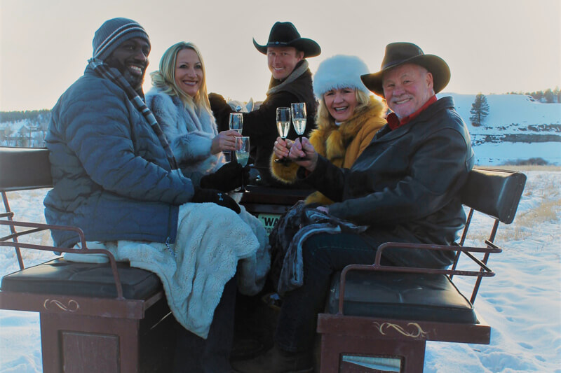 Four people enjoy a private ride